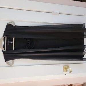 WHBM long, flowy, and sleeveless tunic blouse made of black tencel and crepe